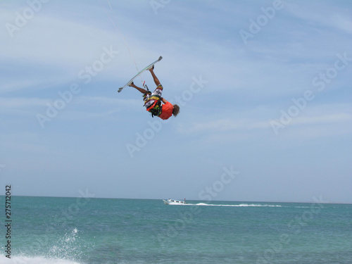 Men doing kitesurfing