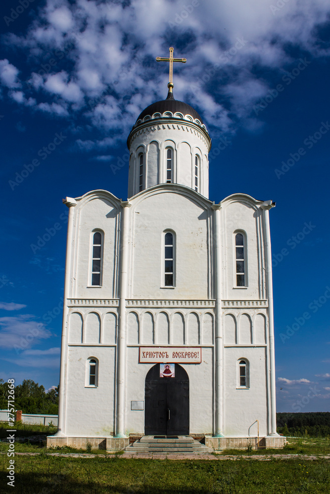 Orthodox Church of white stone on a clear Sunny day Russia