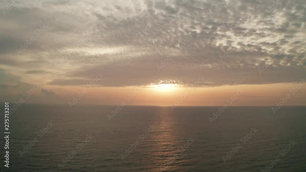 Aerial cinematic drone time lapse of sea and amazing sunset with cloudy sky Aerial cinematic drone time lapse of sea and amazing sunset with cloudy sky
