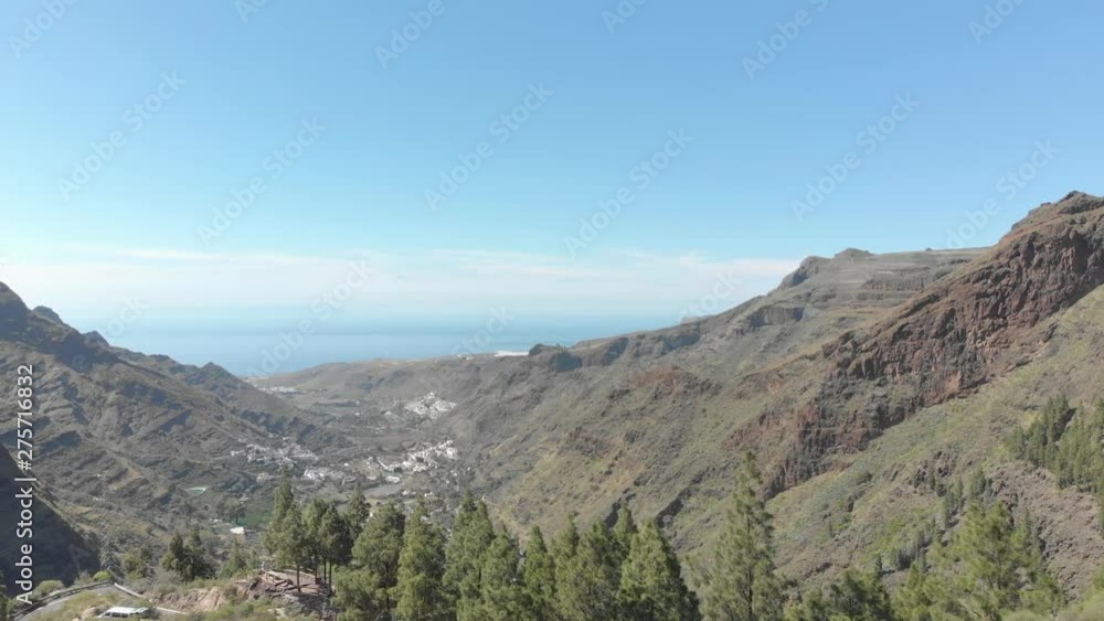 Aerial view of the Agaete Valley (Los Berrazales) (East-West direction towards the valley viewpoint), town of the municipality of Agaete, northwest of the Canary Island of Gran Canaria. (Spain, Europe Aerial view of the Agaete Valley (Los Berrazales) (East-West direction towards the valley viewpoint), town of the municipality of Agaete, northwest of the Canary Island of Gran Canaria. (Spain, Europe