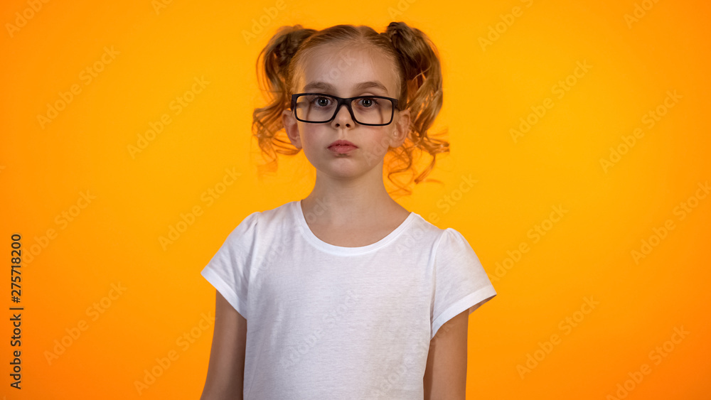 Beautiful teenage girl in eyeglasses looking to camera, little nerd, education Beautiful teenage girl in eyeglasses looking to camera, little nerd, education