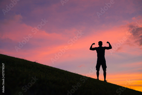 Fototapeta Naklejka Na Ścianę i Meble -  Strong man flexing. Fitness and people power concept. 
