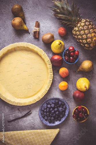 Preparation of Fruit Pie with Colorful Fruits and Fresh Dough Ready to Bake