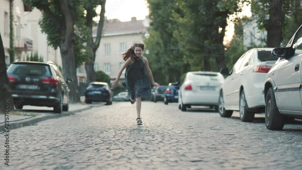 Cute fun teenage girl in green romantic dress running forward. Footage of amazing lady. Sport concept. Healthy lifestyle. Idea. Outdoors. Cute fun teenage girl in green romantic dress running forward. Footage of amazing lady. Sport concept. Healthy lifestyle. Idea. Outdoors.