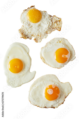 Four fried eggs ranging from soft to crispy photo