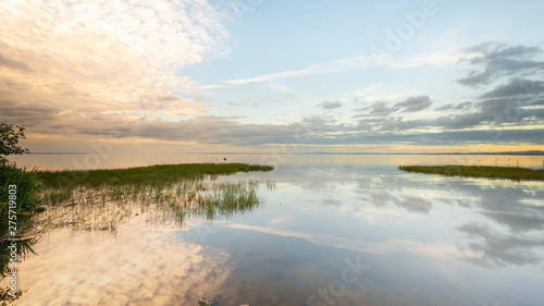Fototapeta Naklejka Na Ścianę i Meble -  Reflections on the becalmed waters of Lough Neagh, County Armagh, Northern Ireland 