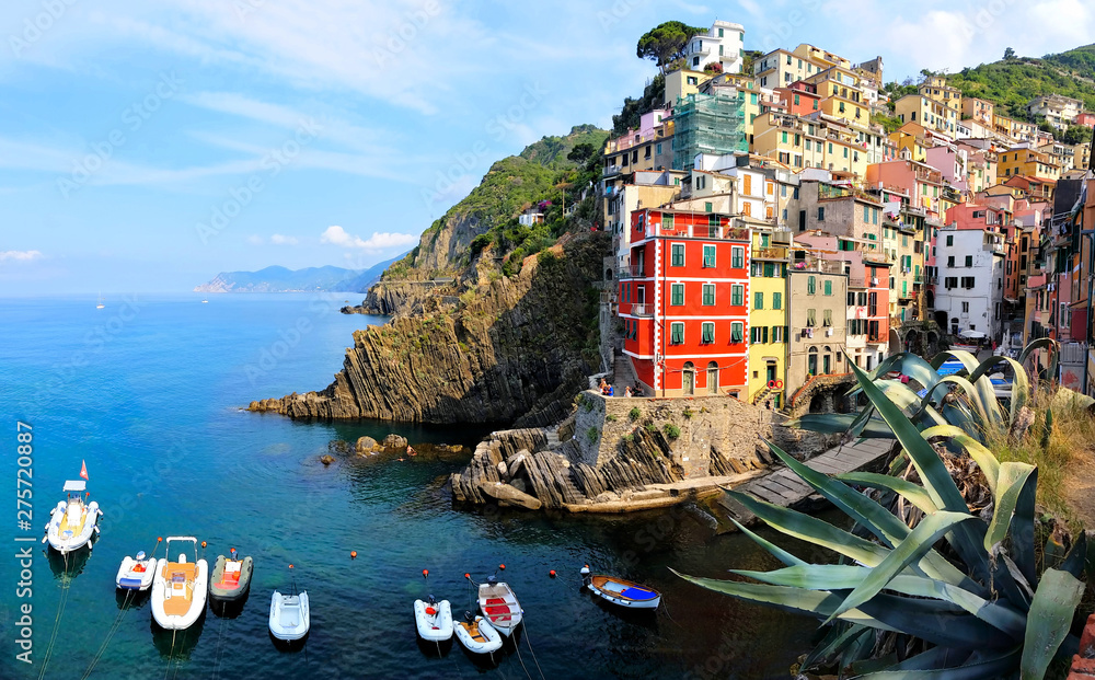 Beautiful coastal village of Riomaggiore with boats, Cinque Terre, Italy