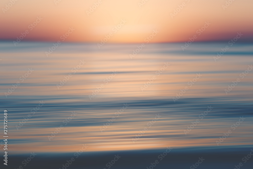 Blurred abstract design that looks like a sunset, could be used as a greeting card, invitation, background for social media
