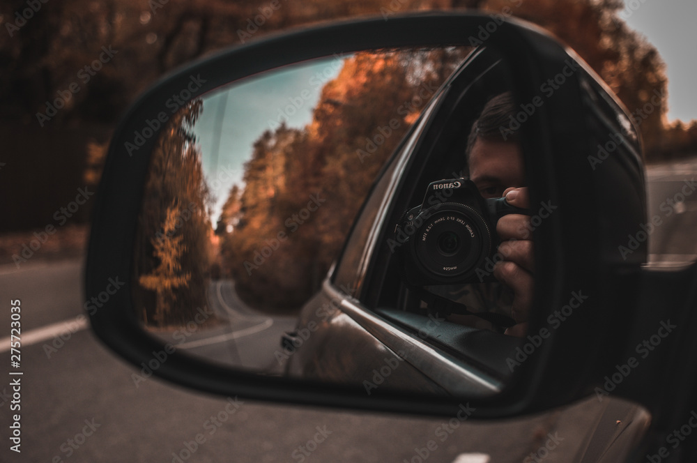 reflection of the road in the car mirror