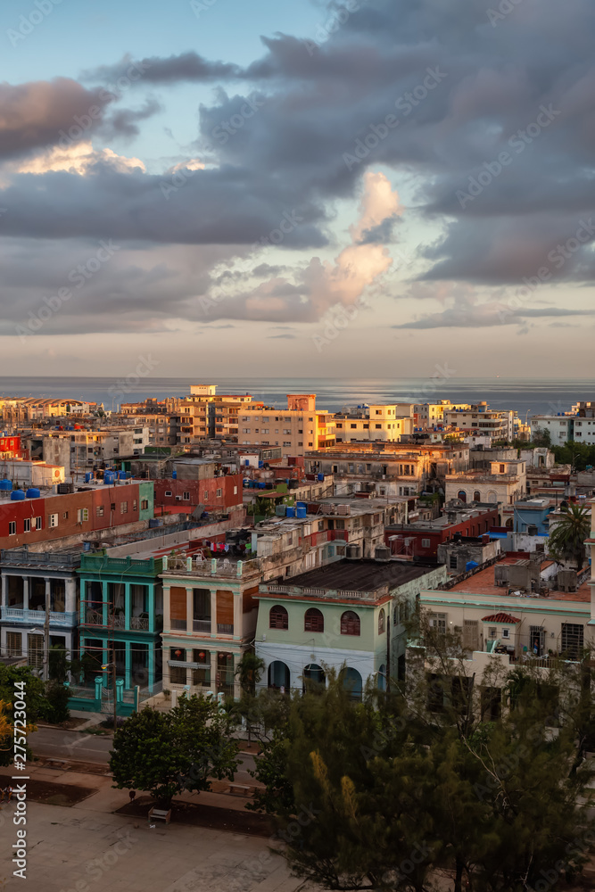 Aerial view of the residential homes in Havana City, Capital of Cuba, during a colorful cloudy sunrise.