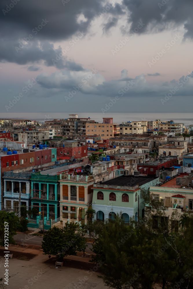 Aerial view of the residential homes in Havana City, Capital of Cuba, during a colorful cloudy sunrise.