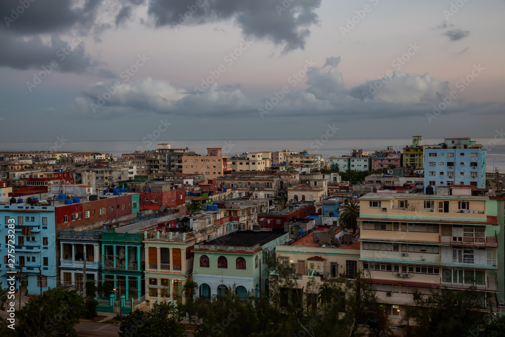 Aerial view of the residential homes in Havana City, Capital of Cuba, during a colorful cloudy sunrise.