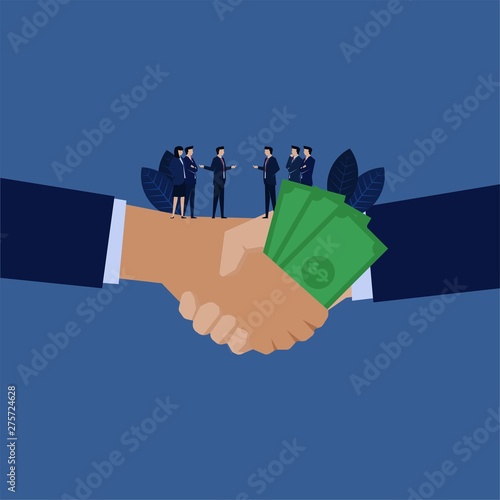 Business handshake with money metaphor of corruption.