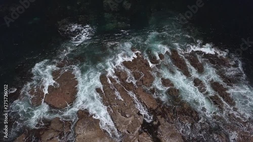 top view of the mighty waves of the Indian ocean shattering against the rugged rocks of Busselton autralia photo