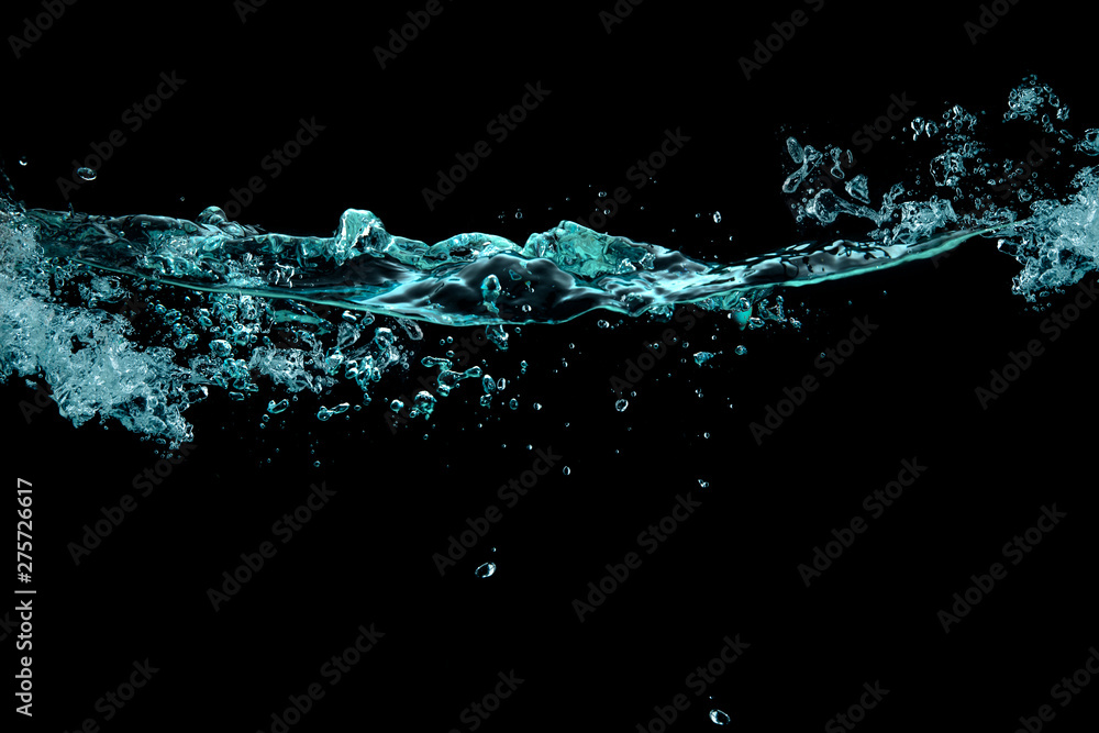 Turbulence, splash and bubbles on a liquid surface. waterline over black background