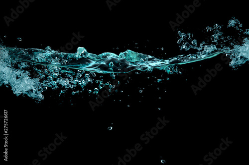 Turbulence, splash and bubbles on a liquid surface. waterline over black background