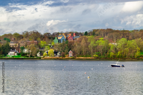 Typical landscape scenery with houses and a boat in Lloyd Harbor in Long Island New York © Hakan Ozturk