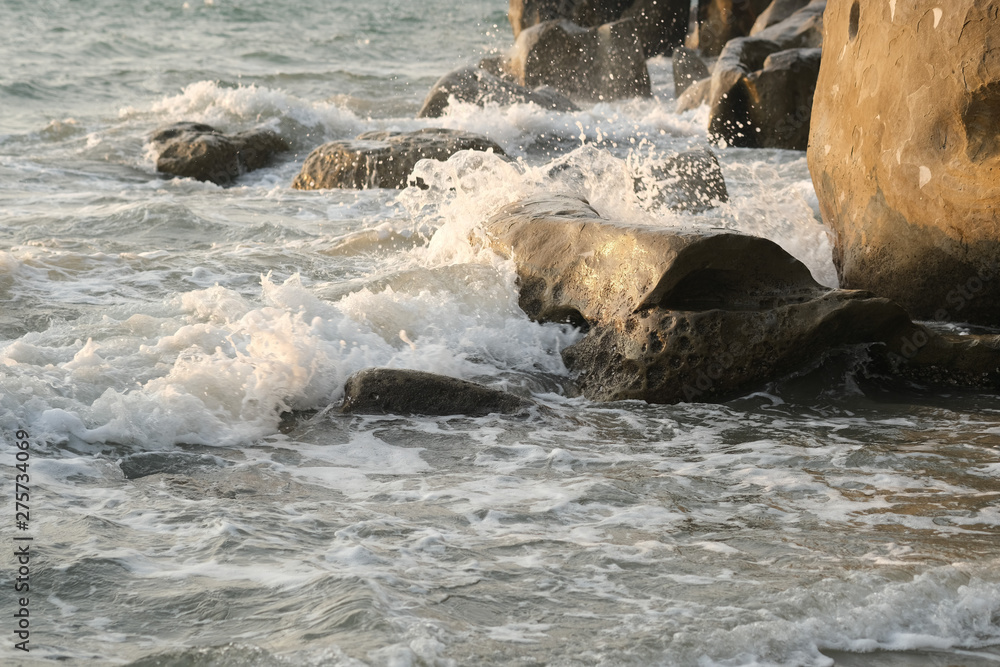 Seawaves hitting rocks on beach. Seawaves hitting rocks on beach.