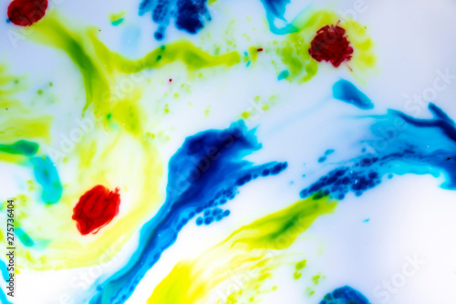 Abstract Primary Color Ink Splats Splotches of bright color on a white background. Scientific, artistic look. Spreading color movement. Microscopic look.