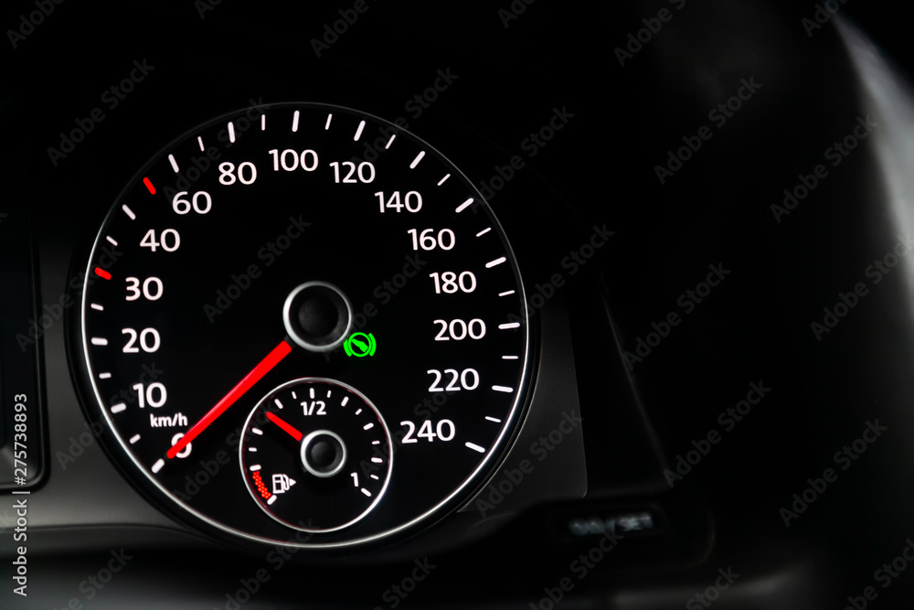 Car dashboard wuth white backlight: Odometer, speedometer, tachometer, fuel level, water temperature and more