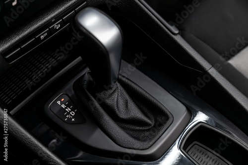 Close up of the automatic gearbox lever, blackinterior car; Automatic transmission gearshift stick;