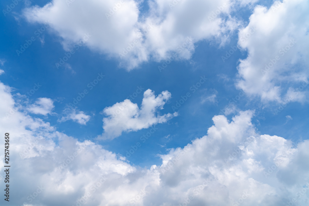 Obraz premium Sunshine white clouds sky during morning like in the heaven, soft focus lens flare sunlight. Abstract blurred cyan gradient of peaceful nature. Open view out windows beautiful summer spring