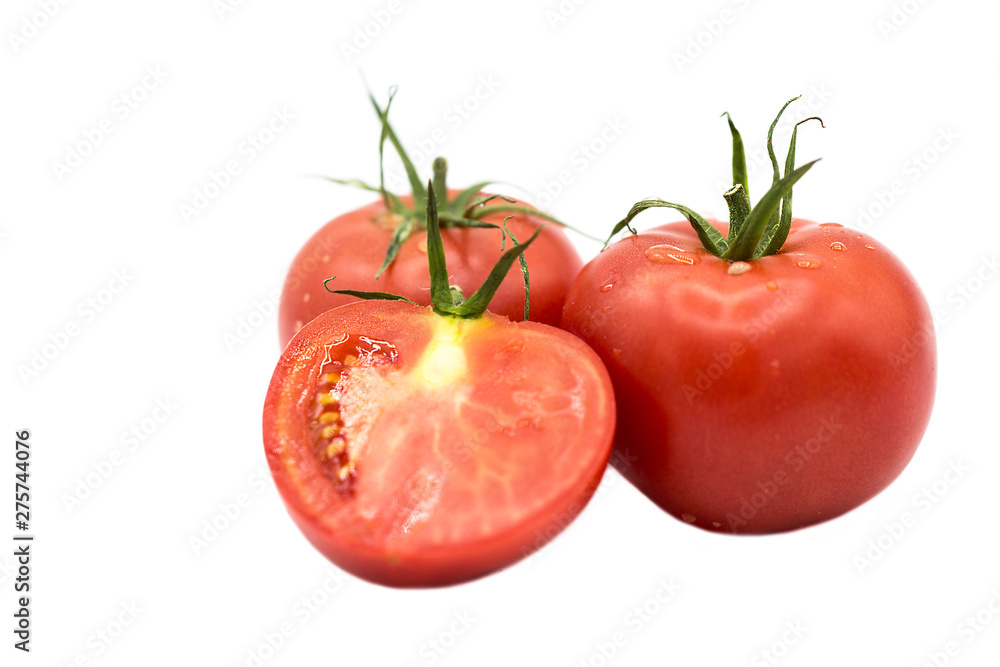 ripe fresh organic tomatoes and half a tomato in drops of dew isolated on white background ripe fresh organic tomatoes and half a tomato in drops of dew isolated on white background