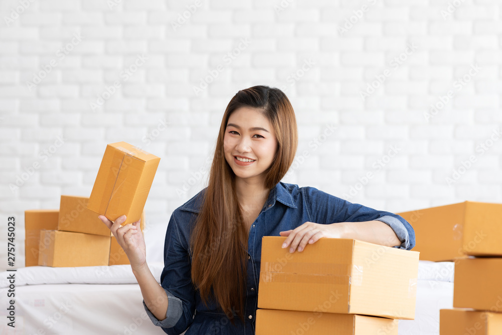 SME entrepreneur of Young Asian women working with laptop for Online shopping at home,Cheerful and Happy with box for packaging in home,Own Business Start up for Business Online and Online shopping SME entrepreneur of Young Asian women working with laptop for Online shopping at home,Cheerful and Happy with box for packaging in home,Own Business Start up for Business Online and Online shopping