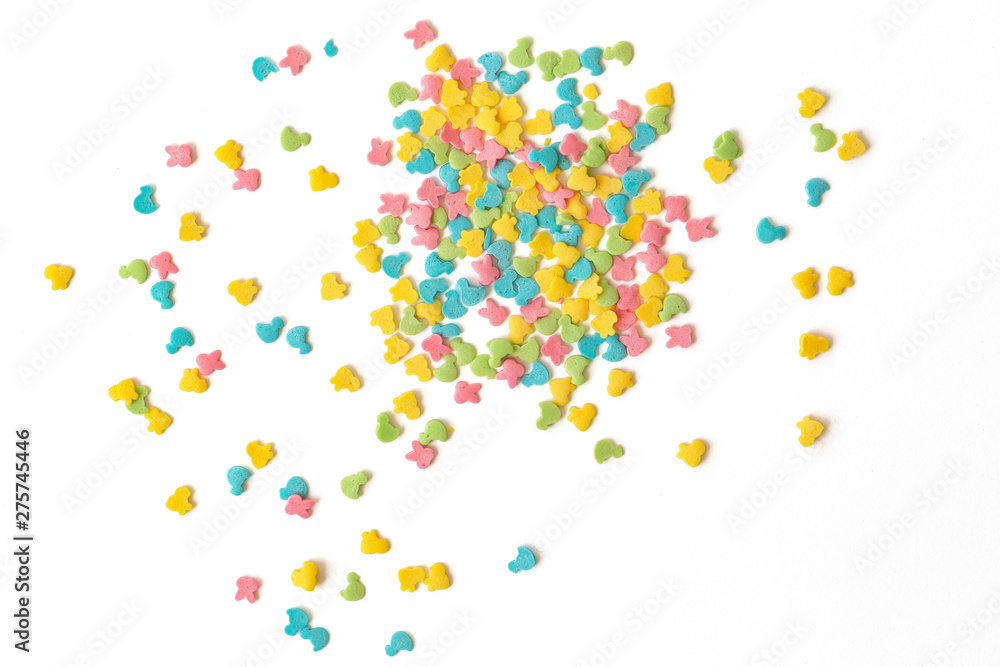 Candy sprinkles. Colorful cake sprinkles scattered over white background.