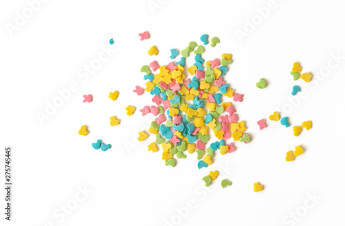 Candy sprinkles. Colorful cake sprinkles scattered over white background.