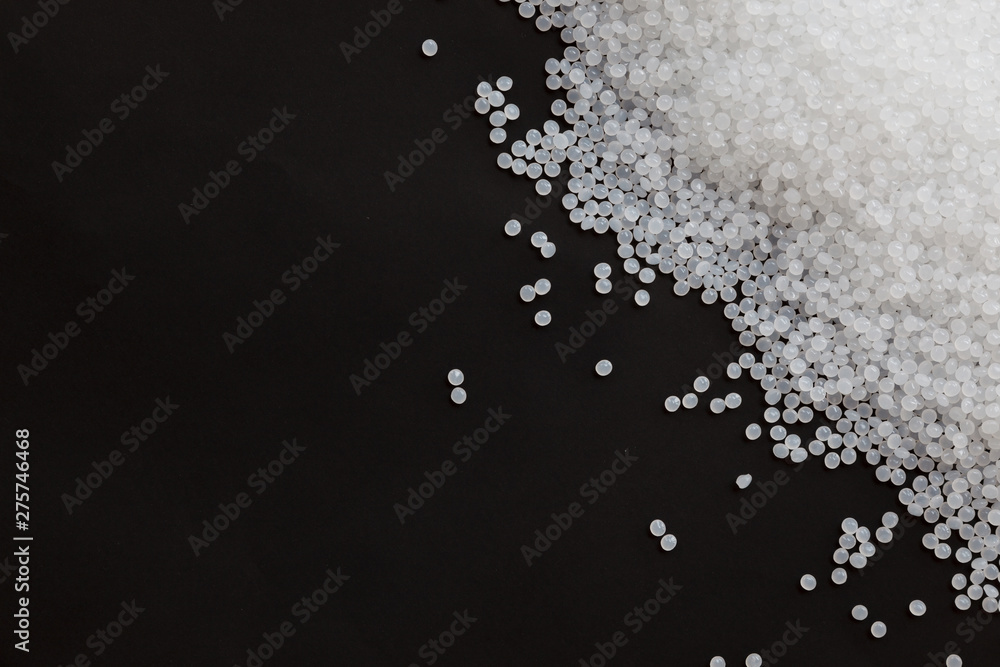Obraz premium Close-up of plastic polymer granules, polymer plastic, polymer pallet, Plastic ball.