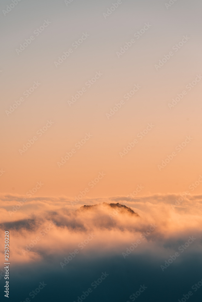 View of marine layer low clouds over Los Angeles at sunset, from Mount Wilson, in Angeles National Forest, California View of marine layer low clouds over Los Angeles at sunset, from Mount Wilson, in Angeles National Forest, California