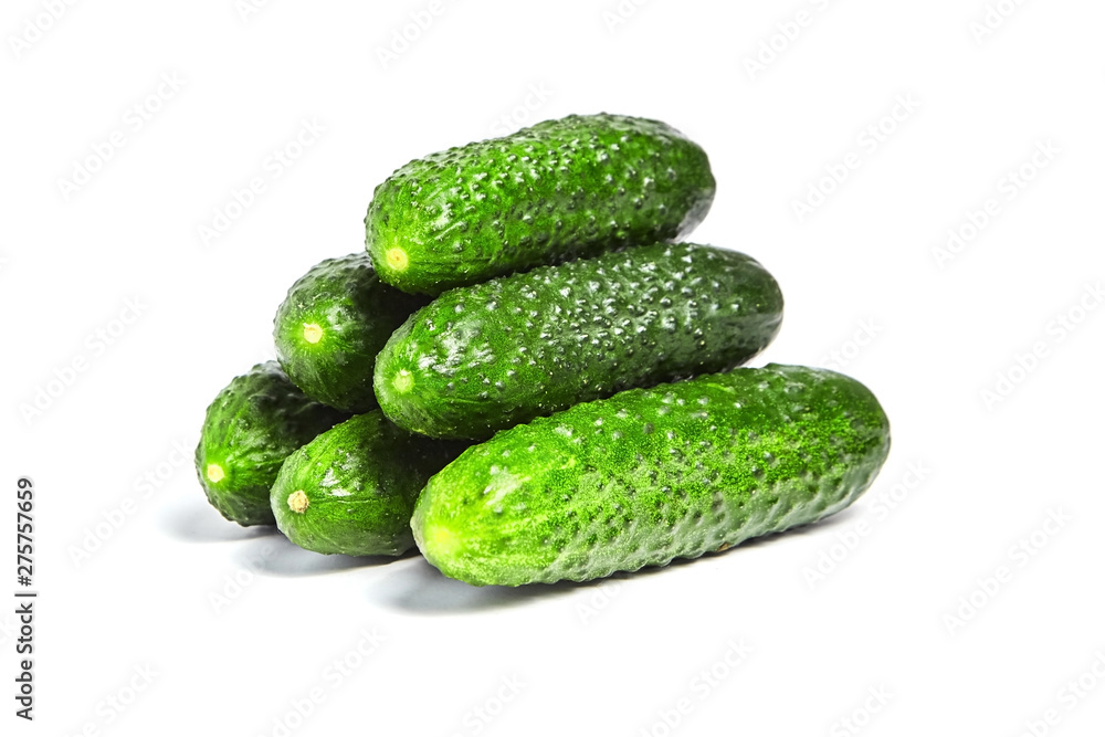Heap of fresh green gherkins isolated on white background Heap of fresh green gherkins isolated on white background