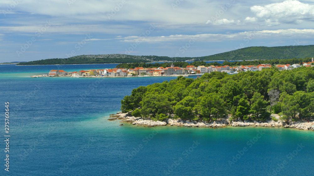 Dark blue sea along beatiful Dalmatia Coast with small historic villages and pine trees, Croatia