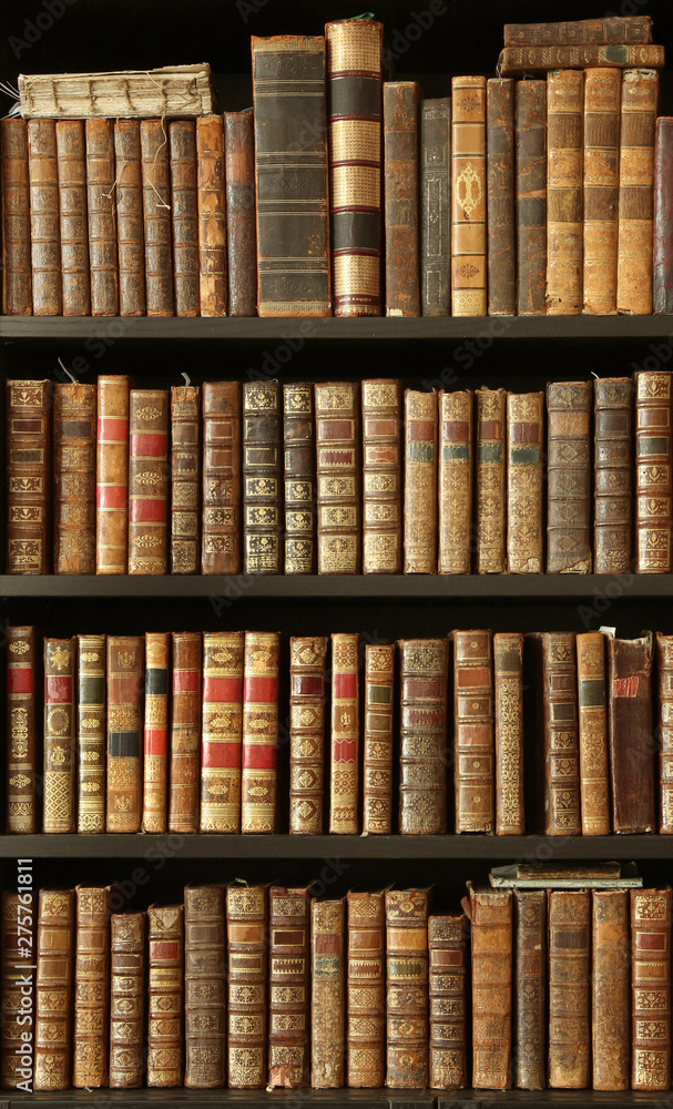 old books on wooden shelf old books on wooden shelf