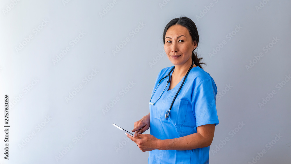 Portrait of young attractive smiling nurse. Hoome nurse. Caucasian woman working in nursing home. Beautiful young nurse woman wearing uniform and stethoscope Portrait of young attractive smiling nurse. Hoome nurse. Caucasian woman working in nursing home. Beautiful young nurse woman wearing uniform and stethoscope