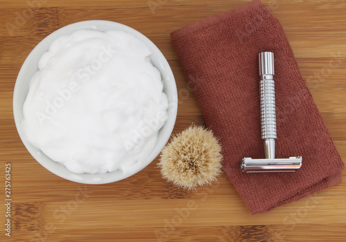 Shaving accessories on wooden background.