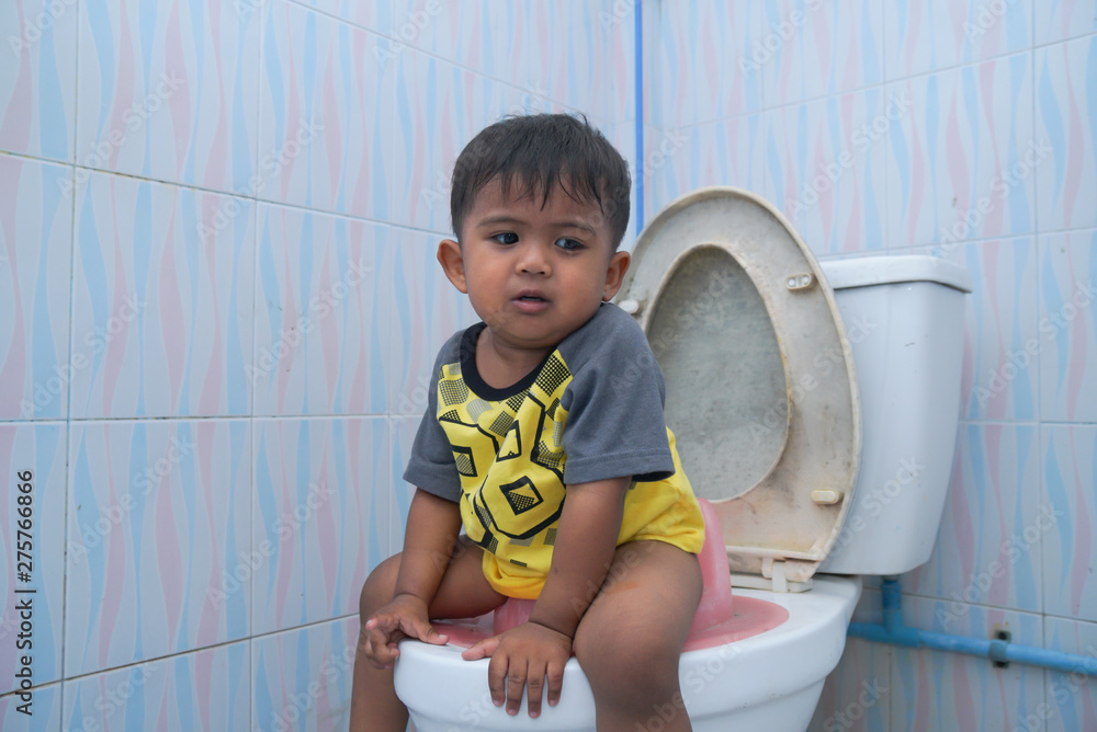 Cute little asian boy sitting on the toilet,Baby constipation Concept Stock Photo Adobe Stock