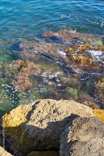  Stone beach of mediterranian sea, sea coast. Natural background. 