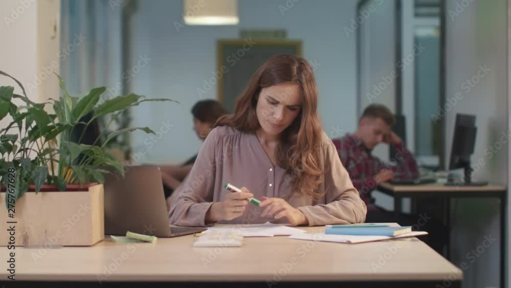 Business woman working documents at coworking. Closeup woman finding mistakes Business woman working documents at coworking. Closeup woman finding mistakes