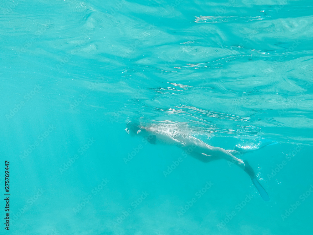 Fototapeta premium Woman snokeling in the sea