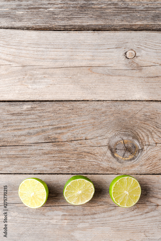 Fresh limes on wooden table. Top view Fresh limes on wooden table. Top view