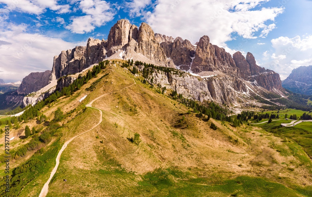 Dolomites - Beautiful panoramic sunset landscape at Gardena Pass (Passo Giau) near Ortisei. Stunning airial view on the top Dolomiti Alps Mountains from drone on summer day, Italy, south Tyrol Europe