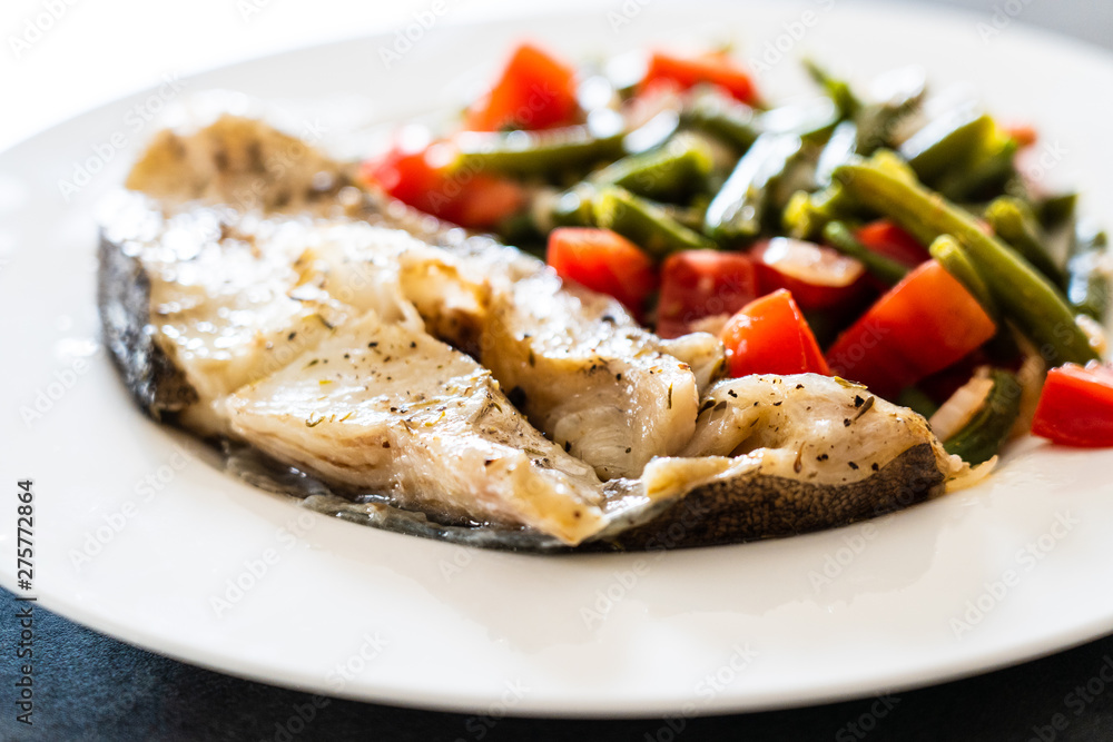 Fish dish - fish fillet in sauce and vegetables