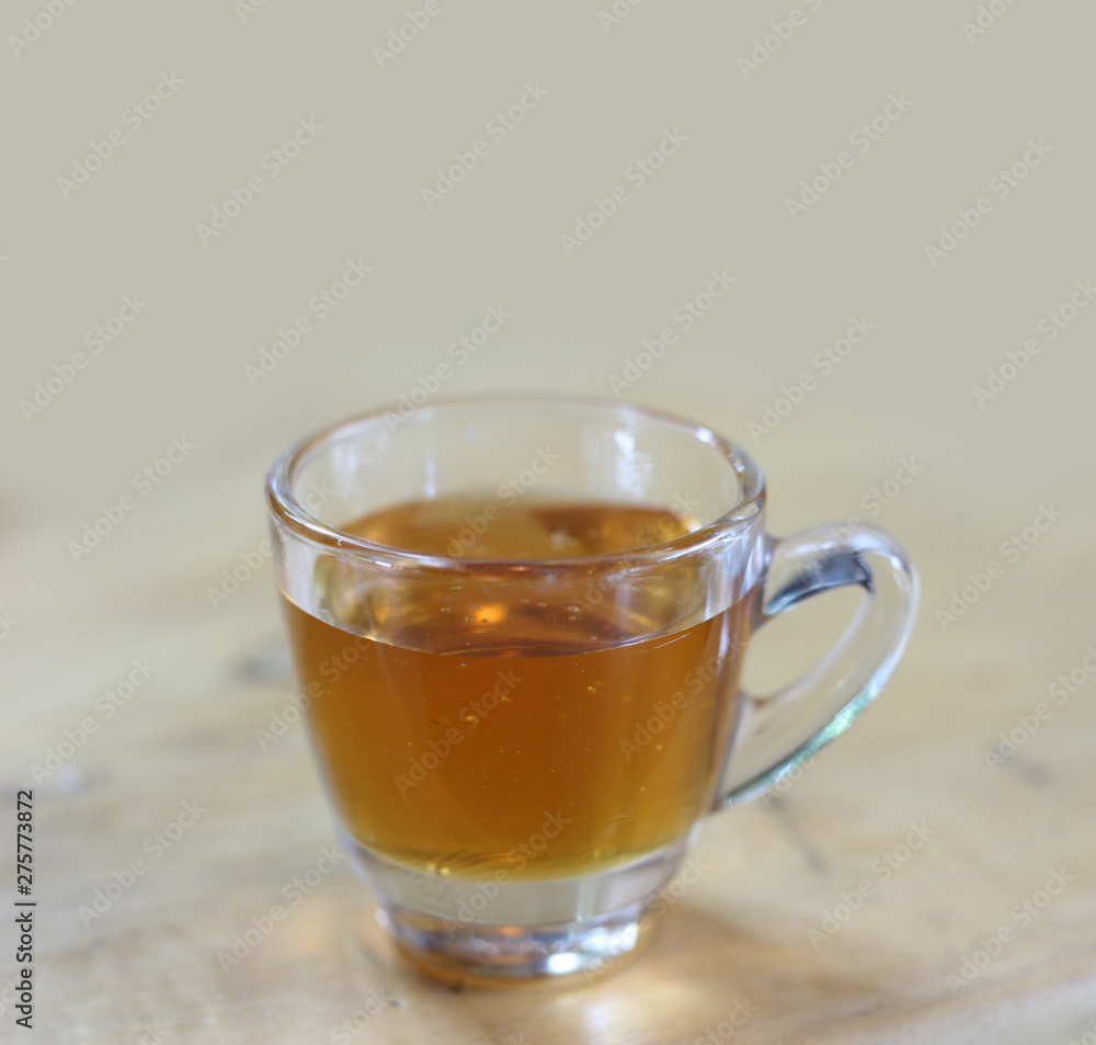 honey in glass on wood background honey in glass on wood background