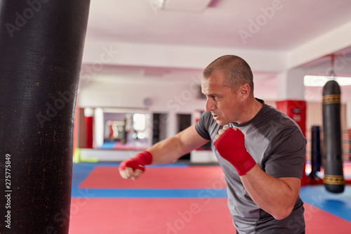 Boxer with heavy bag