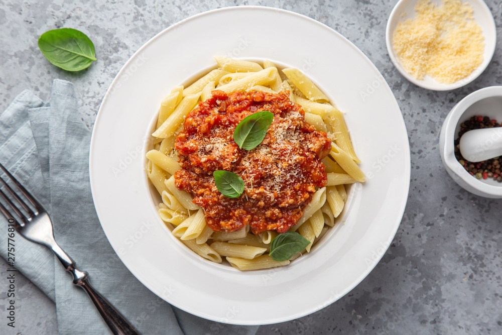 penne pasta with Bolognese sause in white plate penne pasta with Bolognese sause in white plate