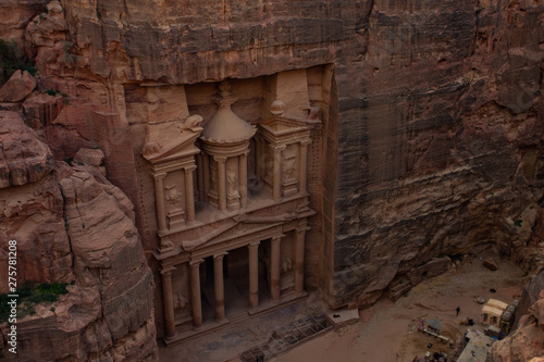 Petra Middle East world heritage touristic site of ancient city treasure carved in rocky stone, photography foreshortening from above in evening twilight time 