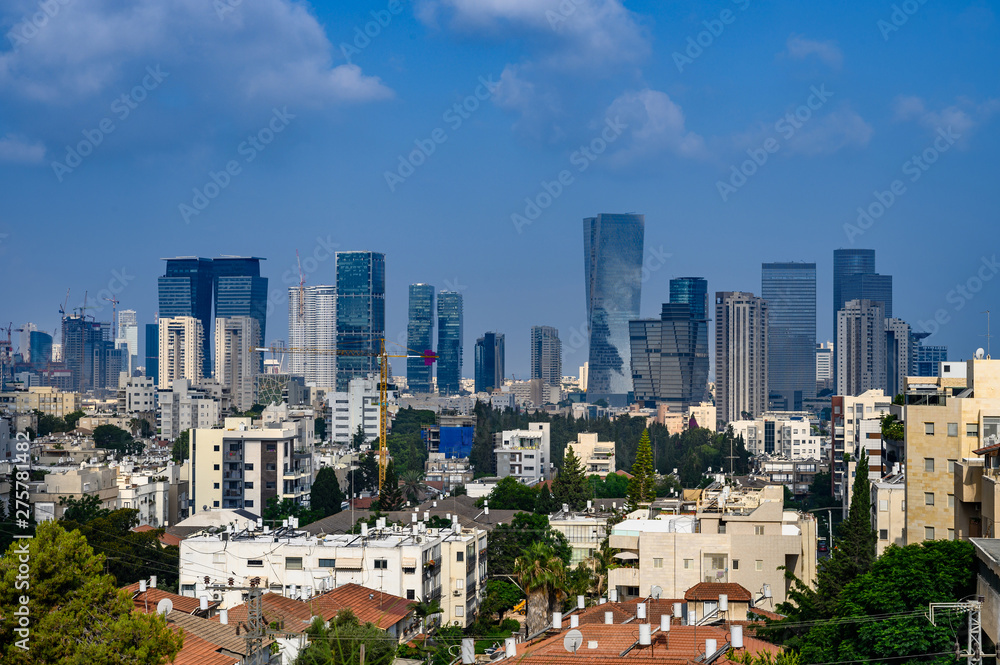 Tel Aviv skyline in early morning.  Rooftop view to the city. Old houses and new modern skyscrapers.