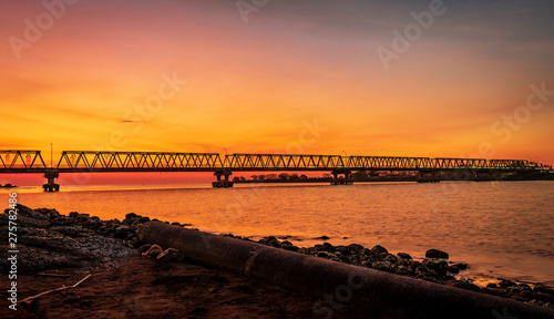 sunset view at borombong bridge makassar. © javed